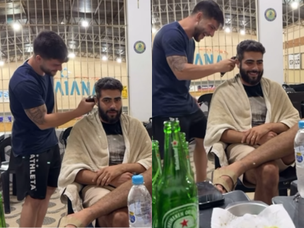 Henrique coloca barbeiro para cortar seu cabelo em meio a treino de futevôlei. Veja!