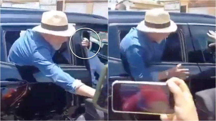 Lula prende a mão na porta do carro; assista ao vídeo